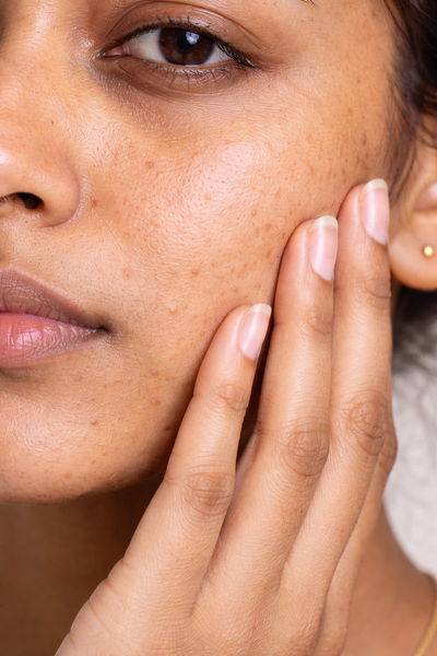 Close-up of a person's neck visible skin texture.
